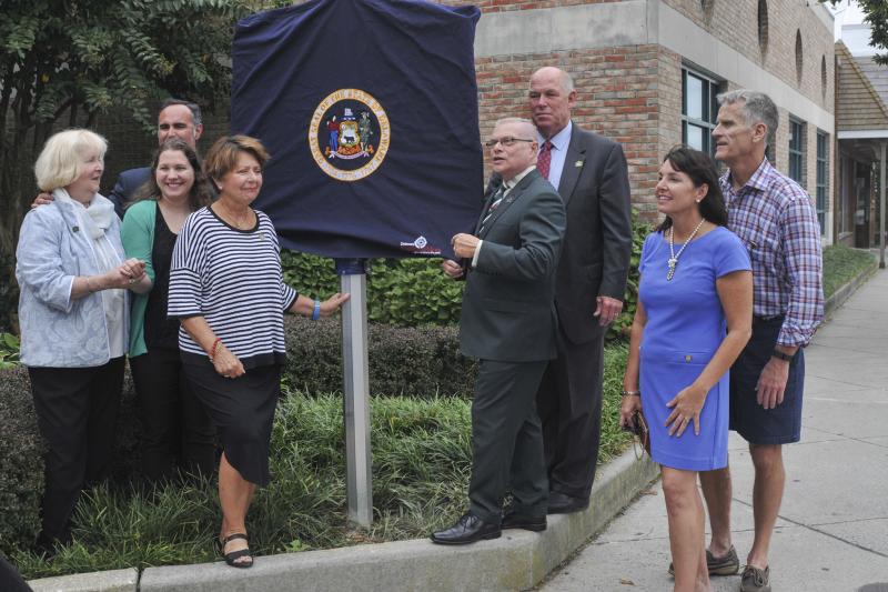 Dignitaries and Village Improvement Association members gathered at the Rehoboth library to celebrate the historic marker. Shown are (l-r) VIA member Barbara Beatty; Rehoboth Library Director Allison Miller; Sen. Ernie Lopez, R-Lewes; VIA President Rose Marie Patin; State Archivist Stephen Marz; Speaker of the House Rep. Pete Schwartzkopf, D-Rehoboth; Rehoboth Commissioner Kathy McGuiness; and Mayor Paul Kuhns. DENY HOWETH PHOTOS